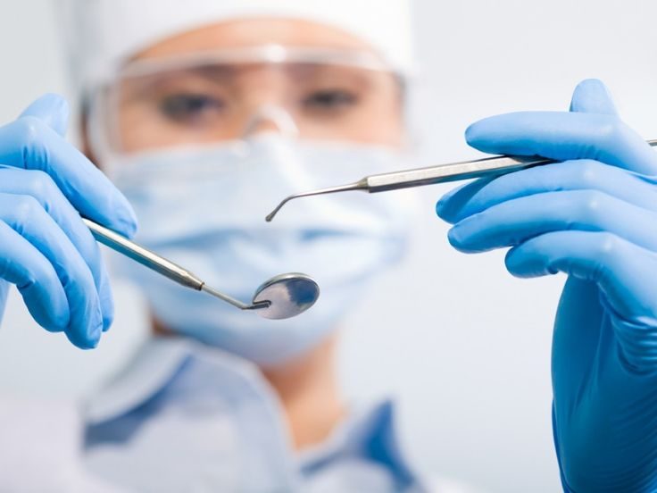 Dental professional carrying out a clinical assessment