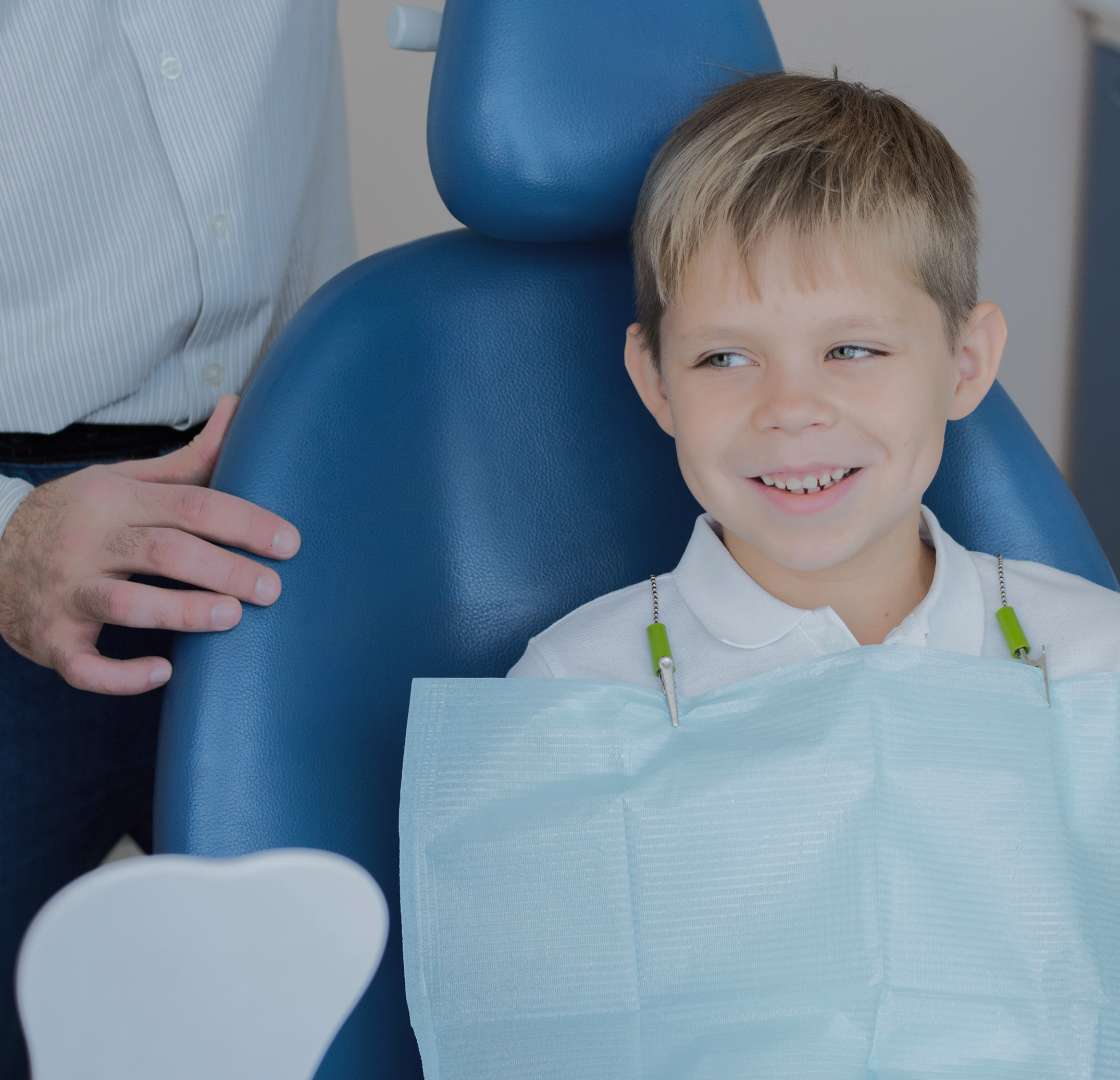 Child smiling during a reassuring dental visit
